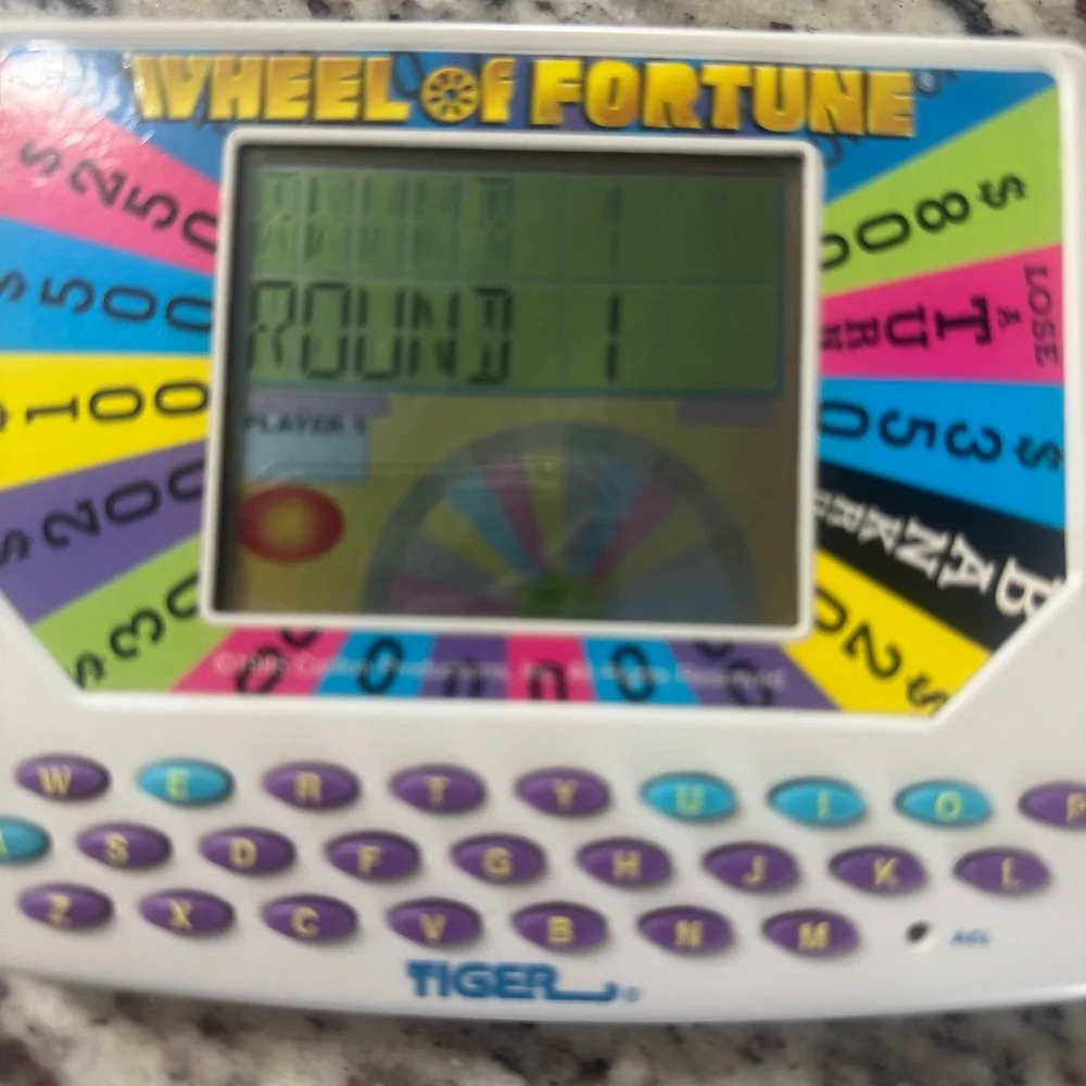 Tiger Wheel of Fortune Handheld Game 1995 – Tested & Working with Sound‎
